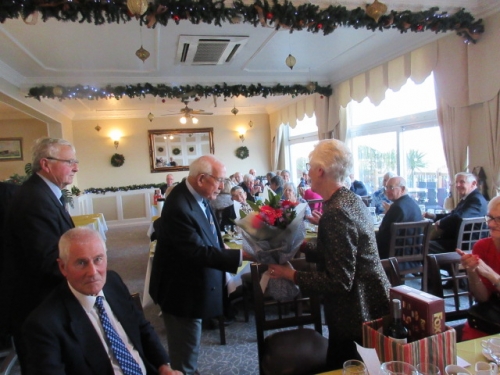 13th December 2019 Alan Tulloch presents Pam Snow a bouquet to say farewell.