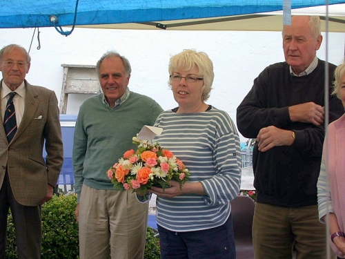 Georgie Hibberd presented with bouquet at 2007 BBQ. Hedley Kett, Peter Goldberg and Tony McGinnity behind.