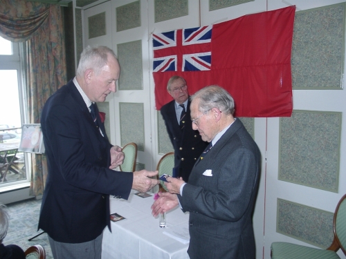 Tony McGinnity presenting Hedley Kett with his Merchant Navy Veteran's Badge February 2007